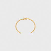 TRIOMPHE ASYMMETRIC CUFF IN BRASS WITH GOLD FINISH
