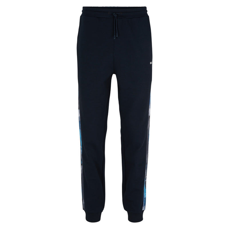 Relaxed-fit tracksuit bottoms with patterned logo inserts