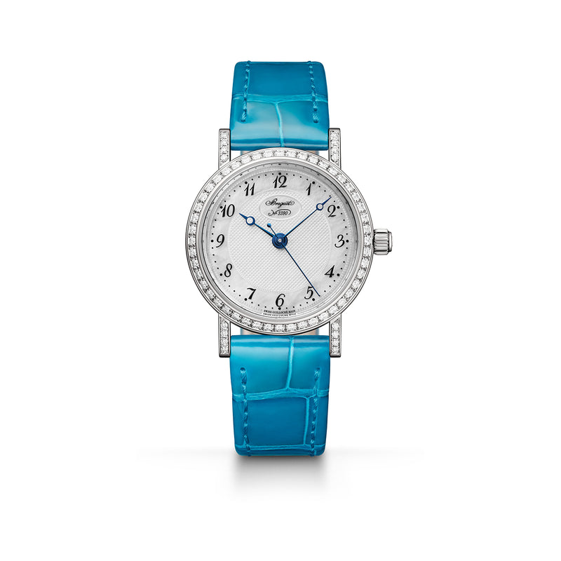 Classique white Gold  Bezel and lugs set with 64 diamonds. Natural mother-of-pearl dial, hand-engraved on a rose engine